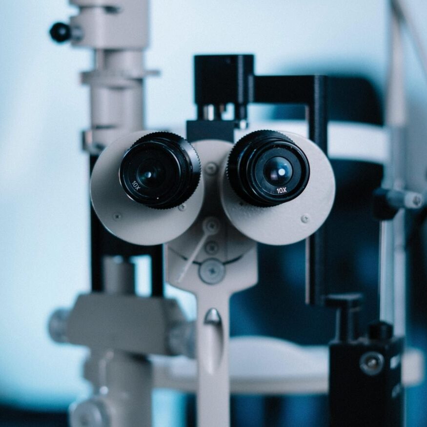Professional studio shot of a modern ophthalmic phoropter used for eye examinations in an optometry clinic.